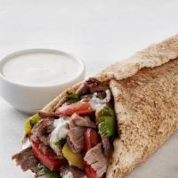 Gyro Sandwich · Slices of beef and lamb mix with onions, tomatoes and Tzatziki sauce.