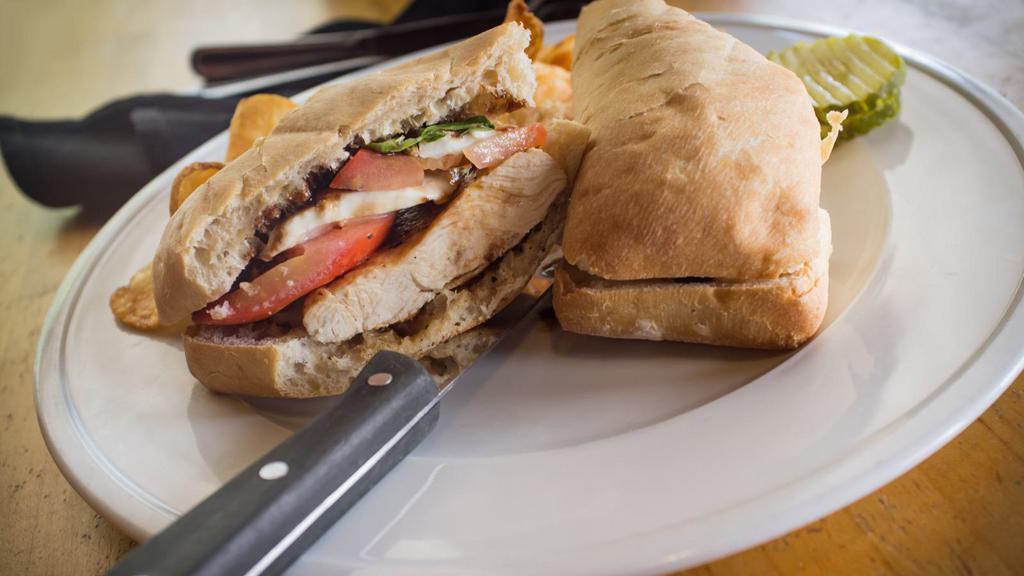 Chicken Kafta Sandwich · Grilled seasoned ground chicken with tomatoes, onions, parsley and garlic sauce.
