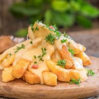 Chili Cheese Fries · Hand cut crispy fries with chili cheese.