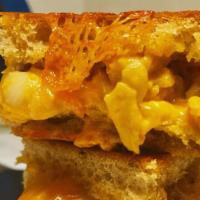 Mac N Cheese Grilled Cheese · Creamy macaroni and cheese. Add a meat for an additional charge.