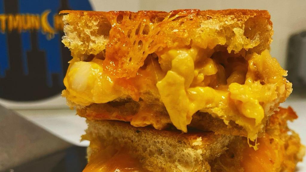 Mac N Cheese Grilled Cheese · Creamy macaroni and cheese. Add a meat for an additional charge.