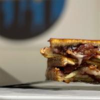 Sweet Cheese · Melted brie cheese topped with bacon, sweet jam, and sliced green apples.