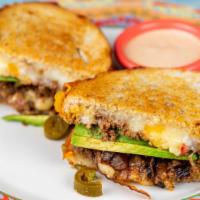 Spicy Joe · A blend of cheddar and pepper jack topped with caramelized onions, avocado, pickled jalapeño...