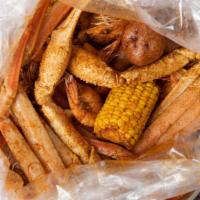 #B. Snow Crab & Whole Shrimp · Each pound seafood comes with one corn and two potatoes.