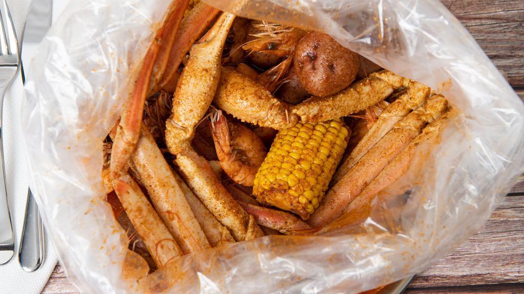 #B. Snow Crab & Whole Shrimp · Each pound seafood comes with one corn and two potatoes.