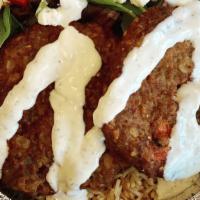 Chapli Kabob Over Rice · Afghan spiced ground beef patties topped over Basmati rice with your choice of side, bread a...