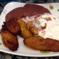 Platanos Con Crema Y Frijoles · Plantain slices served with sour cream and  refried beans.