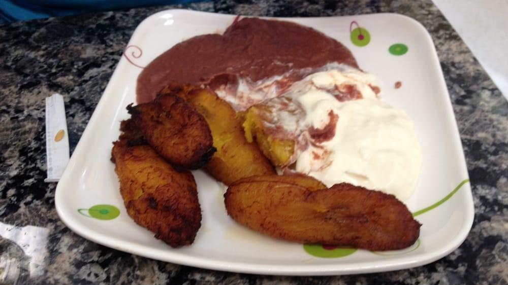 Platanos Con Crema Y Frijoles · Plantain slices served with sour cream and  refried beans.