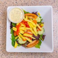 Mango Salad · Mixed greens, roasted bell peppers, carrots, almonds, red onions, sliced mangos with poppy s...