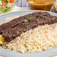 Ground Beef Kabob · Seasoned ground beef grilled on two skewers served on rice with sides of chickpeas, salad, n...
