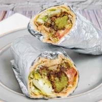 Falafel Wrap · Vegetarian. Naan bread rolled and stuffed with fried chickpea dumplings, lettuce, tomato, cu...