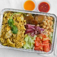 Chicken Over Rice · Chicken with basmati rice, side salad, garbanzo chickpeas, pickles, red onion, lime slice, t...
