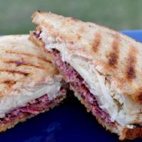 Pastrami-Nova Reuben Sandwich · Dry aged pastrami-nova with sauerkraut, russian dressing and melted cheese on your choice of...