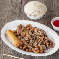 Sesame Chicken · Crispy chicken pieces tossed in a sweet and savory sauce, topped with sesame seeds and serve...