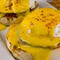 Eggs Benedict · A toasted English Muffin topped with Canadian Bacon, Two(2) poached eggs and our homemade Ho...