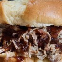 Pulled Pork Sandwich · Classic Pulled Pork Sandwich on a Potato Roll with choice of sauce at pick up.