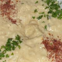 Baba Ghanouj · Oven baked eggplant, mashed and blended with sesame paste (tahini), topped with olive oil an...