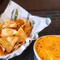 Sam'S Buffalo Chicken Dip · An addictive combination of hot sauce, cream cheese and diced chicken with tortilla chips fo...