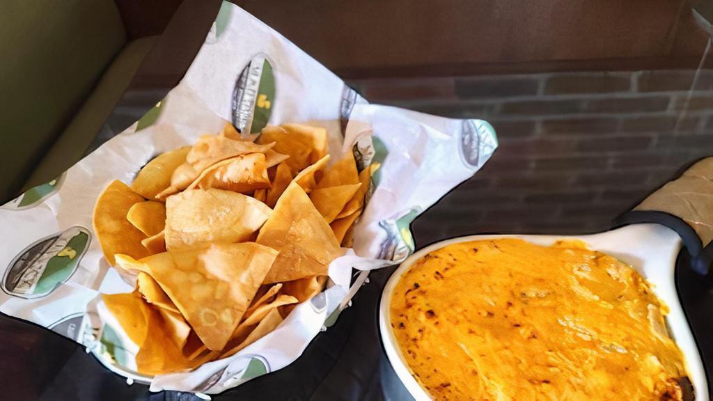 Sam'S Buffalo Chicken Dip · An addictive combination of hot sauce, cream cheese and diced chicken with tortilla chips for dipping.