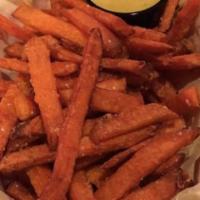 Sweet Potato Fries · Crispy sweet potato French fries with a curry aioli dipping sauce.