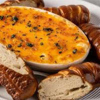 Crab & Artichoke Dip · Served with (3) soft pretzel breadsticks