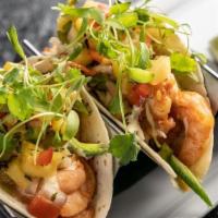 Shrimp Tacos · Marinated shrimp topped with coleslaw, lemon/garlic aioli and pineapple salsa.