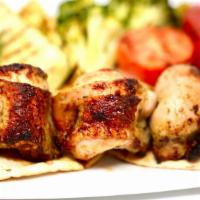 Tequila Lime Chicken · Chicken thighs marinated in tequila, fresh herbs, lime juice, fresh peppers, skewered & gril...