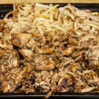 Jerk Chicken Bowl · Jerk chicken, shredded cabbage, over rice