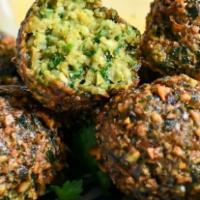 Falafel · A patty made of ground garbanzo beans, onions, parsley and garlic, spiced with our special s...