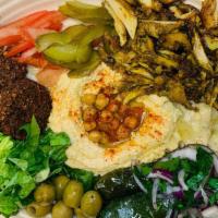 Mezze Plate · Hummus, baba ganoush, falafel, dolmas, tomatoes, olives, cucumbers,feta cheese, israeli pita...
