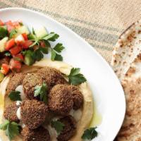 Falafel Plate · Authentic homemade jerusalem style GF falafel.  served on plate with israeli style salad, na...
