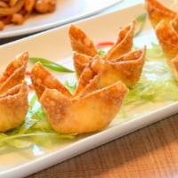 Crab Puffs · Golden wontons filled with cream cheese and imitation crab served with sweet & sour sauce