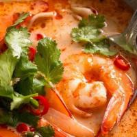 Tom Kha (Large) · Creamy coconut soup with mushrooms, tomatoes, onions, lemongrass, galangal and lime leaves
