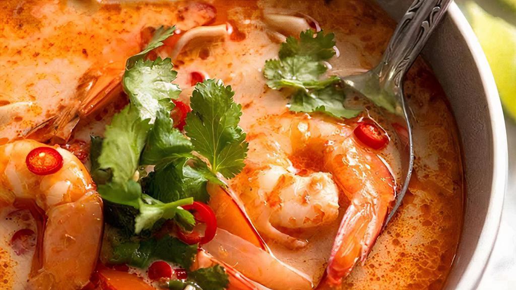 Tom Kha (Large) · Creamy coconut soup with mushrooms, tomatoes, onions, lemongrass, galangal and lime leaves