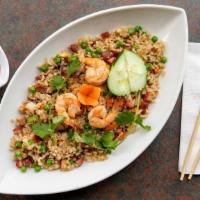 House Fried Rice · Vietnamese fried rice with eggs, Asian sausage, BBQ pork, shrimp, onions, peas and diced car...