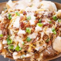 Hot Mess · Large baked potato, butter, cheese, bacon, green onions, Southwestern ranch. Choice of meat:...
