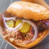Signature Sandwich · Toasted bun, raspberry pepper jelly, red onions, pickles. Choice of meat: brisket, andouille...