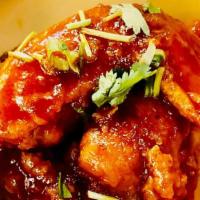 Chicken Wings · Fried chicken wing served with sweet chili sauce or sriracha sauce.