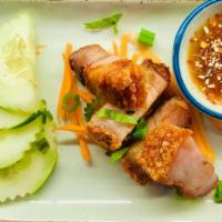 Crispy Pork Belly Appetizer · Served with fresh sliced cucumber and spicy lime juice