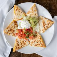 Steak Quesadilla Dinner · Marinated steak and mixed cheese, garnished with lettuce, pico de gallo, guacamole and sour ...