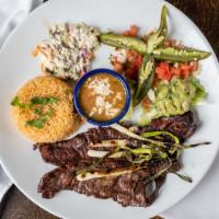 Carne Asada Dinner · El patrons favorite. Thin slices of skirt steak charbroiled and garnished with green onions ...