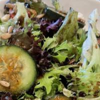 Mediterranean Salad · Arugula, feta, tomato, cucumber, sunflower seeds, onion, and balsamic vinaigrette.