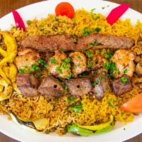 Al Sultan Mixed Grill · Three skewers of our most popular natural wood mesquite grilled kababs (shish kabab, kafta k...