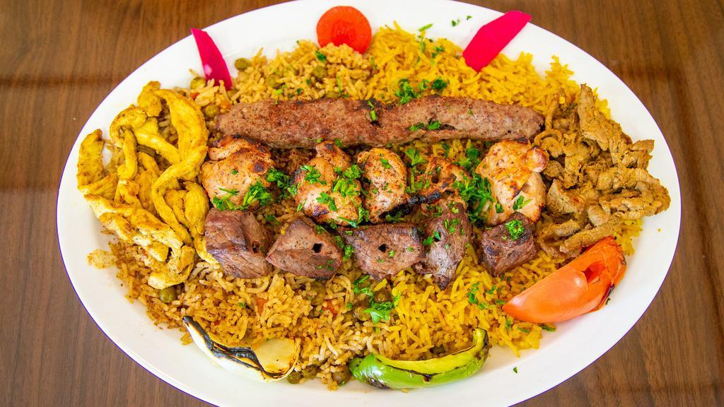 Al Sultan Mixed Grill · Three skewers of our most popular natural wood mesquite grilled kababs (shish kabab, kafta kabab, chicken kabab (tawook), a shawarma garnish and grilled tomatoes and onions, along with your choice of humus or house salad.