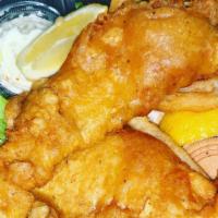 Fish & Chips · Beer battered fresh N. Pacific Cod, filet served with waffle fries, slaw, horseradish dip, a...