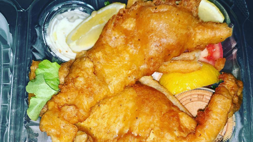 Fish & Chips · Beer battered fresh N. Pacific Cod, filet served with waffle fries, slaw, horseradish dip, and tartar sauce.