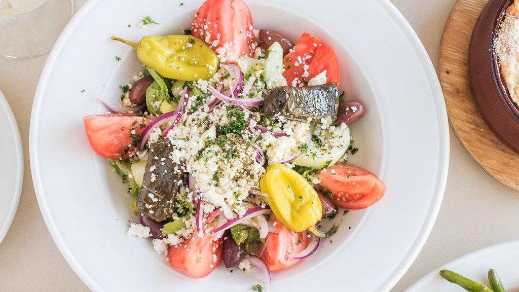 Greek Salad · Lettuce, tomato, onions, cucumbers, kalamata olives, pepperoncini and feta cheese. Served with house dressing.