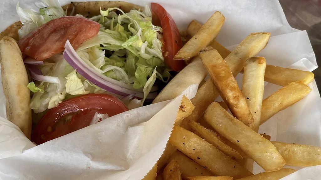 Chicken Gyro · Marinated white meat chicken, grilled to perfection, served with lettuce, tomatoes, onions and tzatziki sauce wrapped in a warm gyro bread.