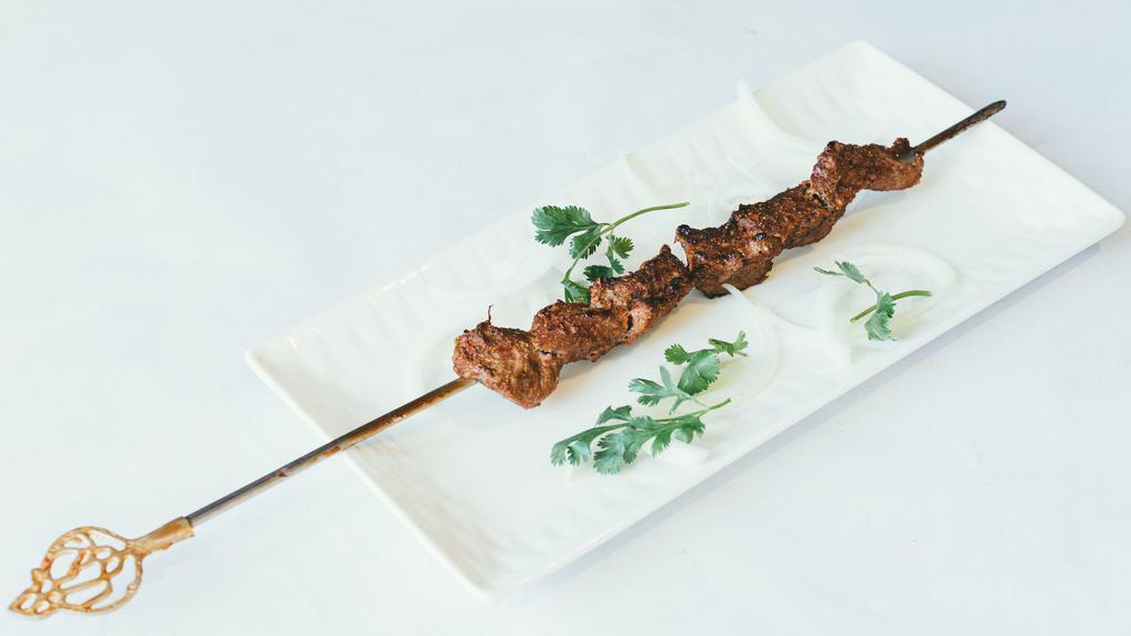 Lamb Kebab · Chunks of lamb marinated in cumin and house spices and served on a skewer.