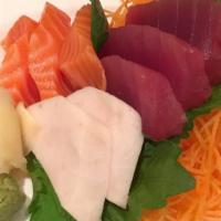 Sashimi Salad · Tuna, salmon, crab meat, shrimp, octopus mixed with sesame dressing sauce.